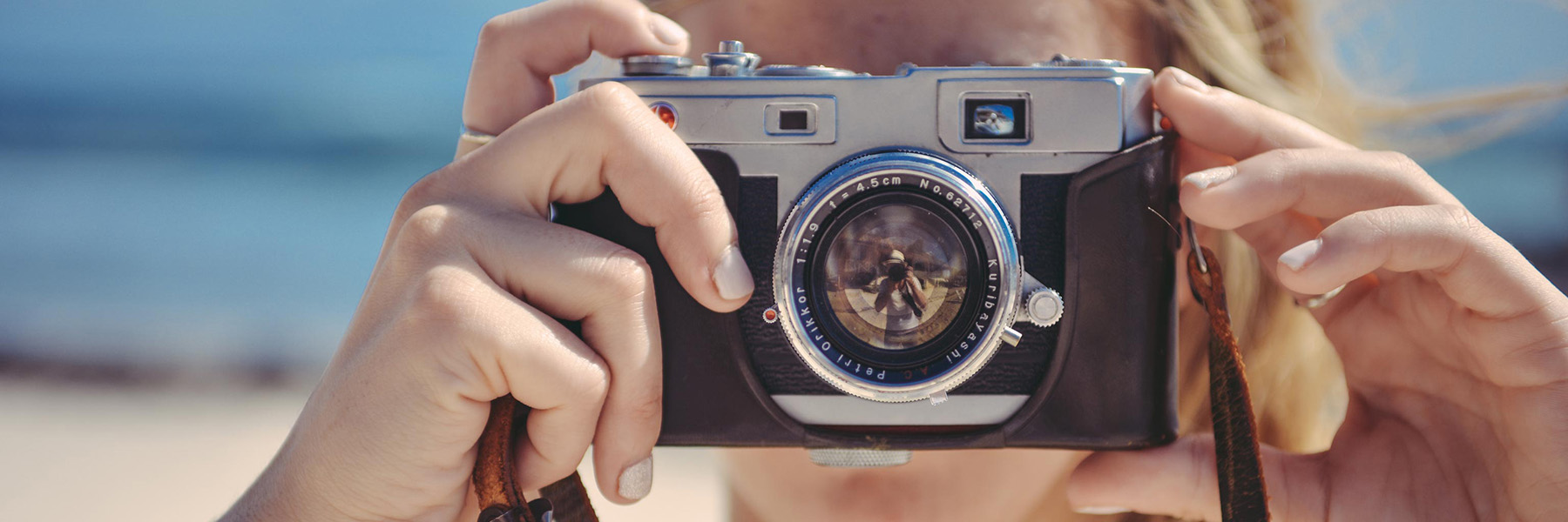 Hand holding a camera