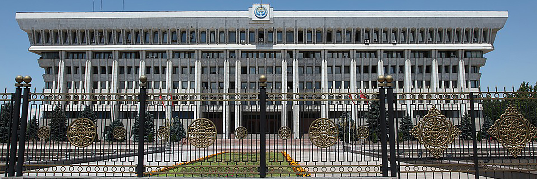 Gate in front of a white building