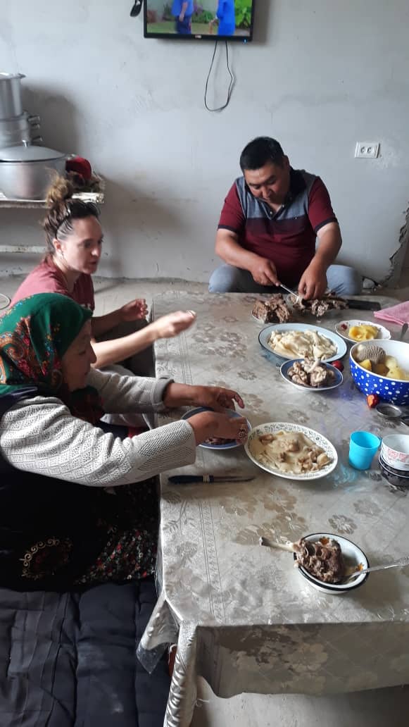 Enjoying beshbarmak with a Kyrgyz family.