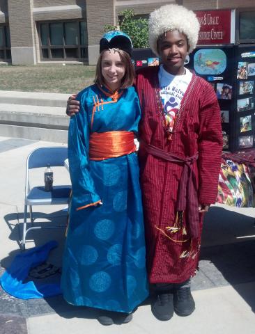 Two students wearing traditional clothing