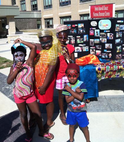 Students wearing traditional clothing and face paint