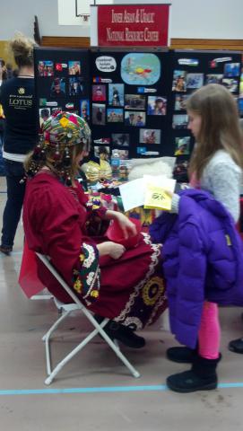 Adult and child at a display