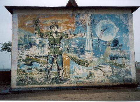 A fading Communist painting on the side of an abandoned apartment building in Choibalsan, Dornod Province.