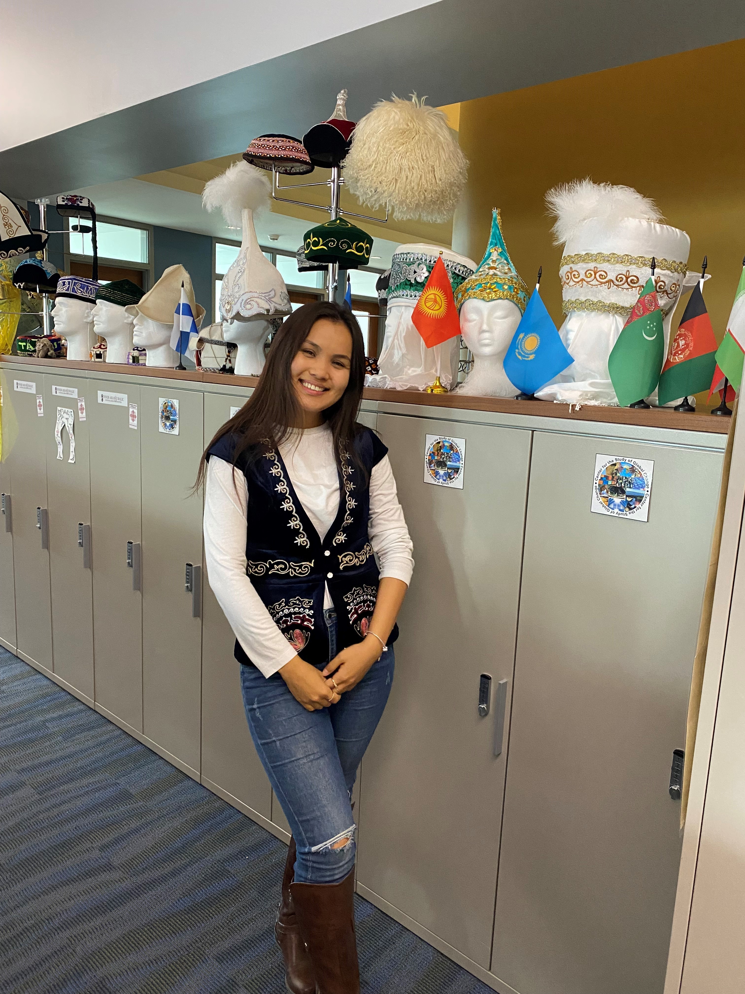 Woman smiling in front of filing cabinets