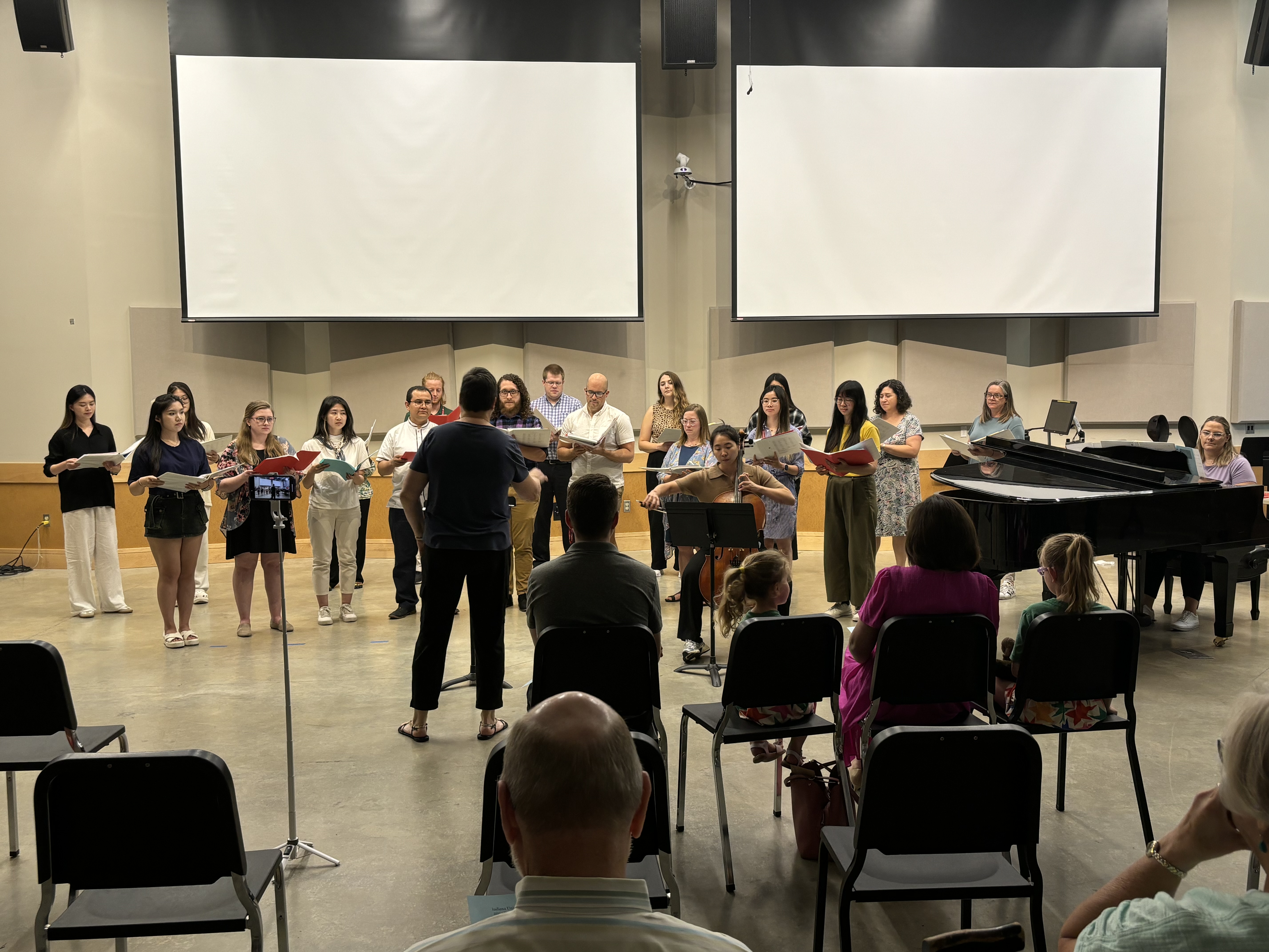 Music classroom, studnents play intruments and sing.