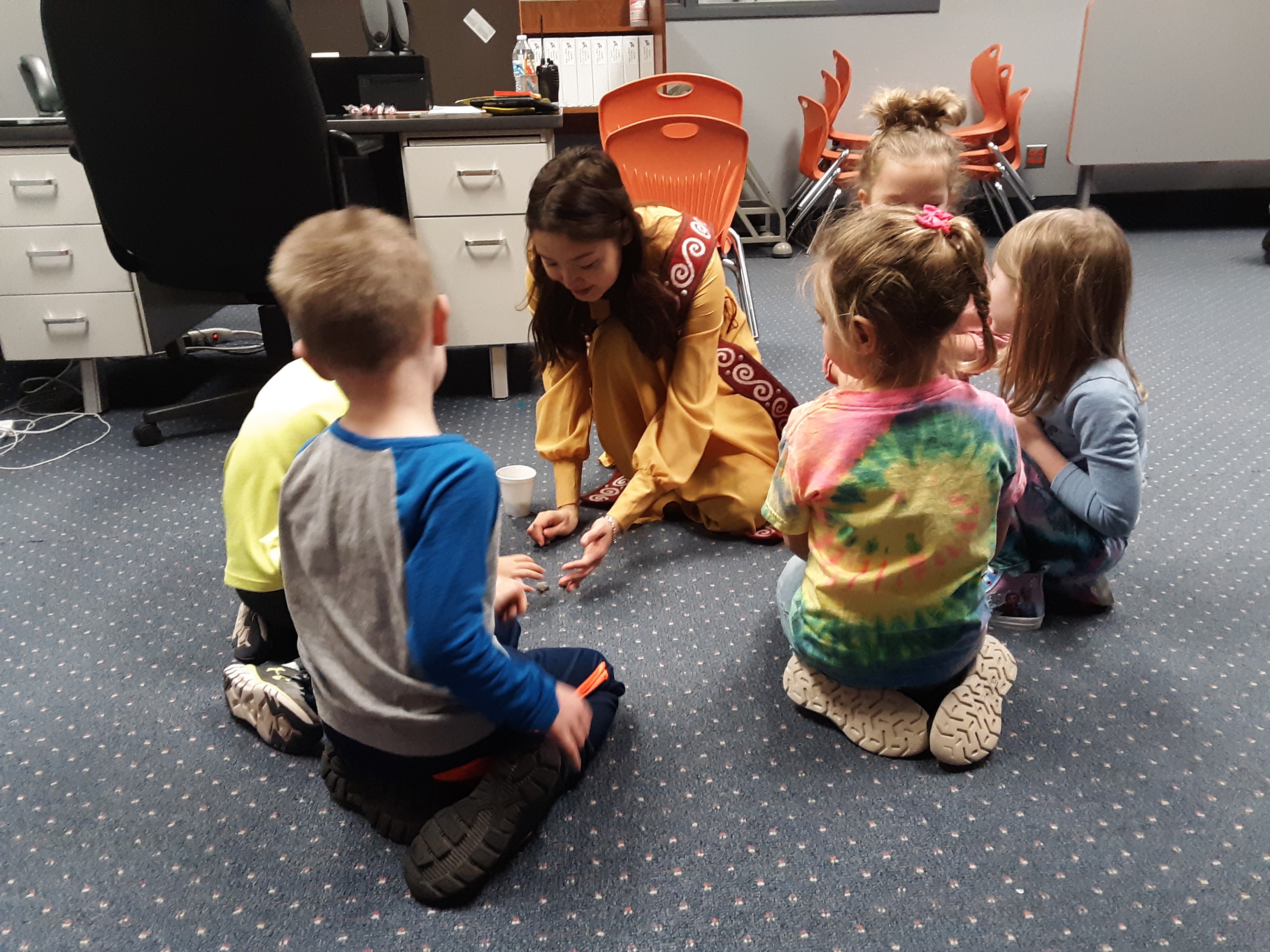 Woman doing activity with children